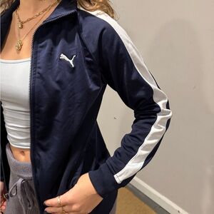 puma blue zip up. size boys medium. lightly worn. white strip on side.